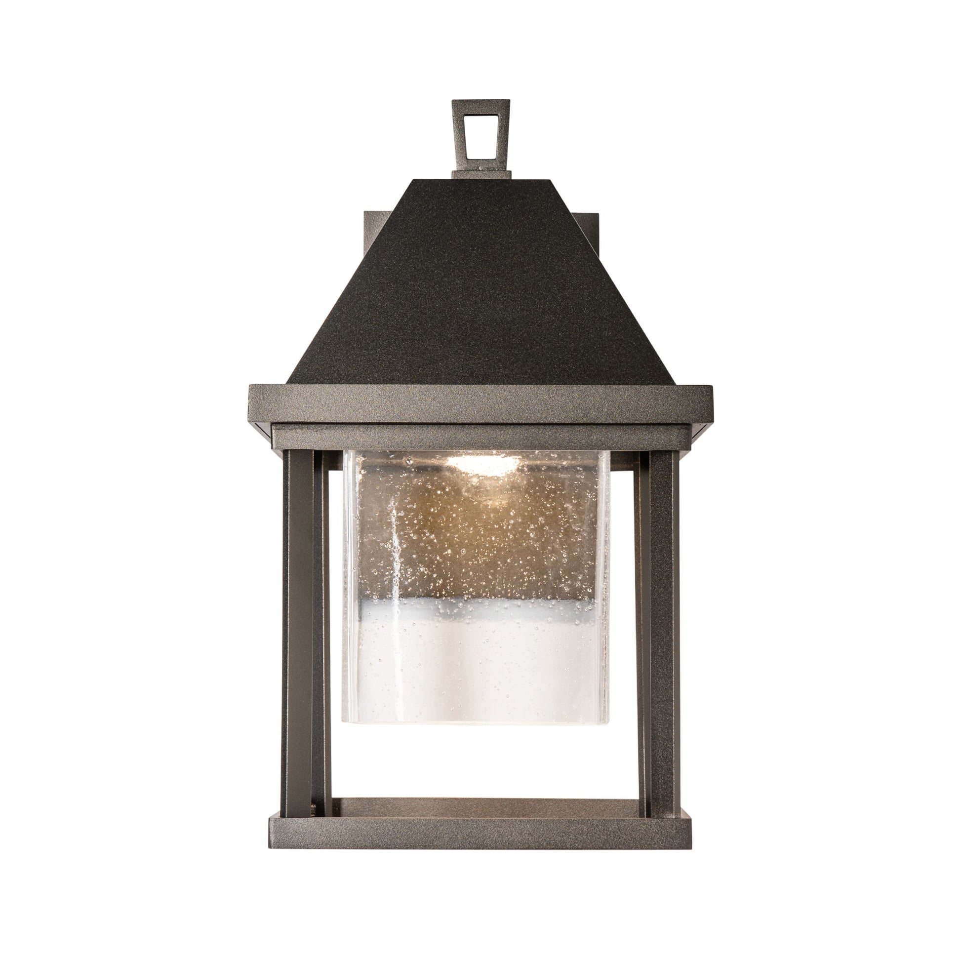 Dorset Small Outdoor Sconce by Hubbardton Forge with clear seeded glass and dark metal frame, showcasing elegant, high-end craftsmanship.
