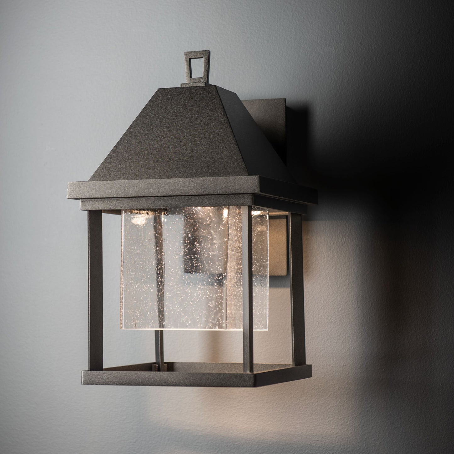 Dorset Small Dark Sky Friendly Outdoor Sconce by Hubbardton Forge, showcasing a metal frame and clear glass in a modern design.