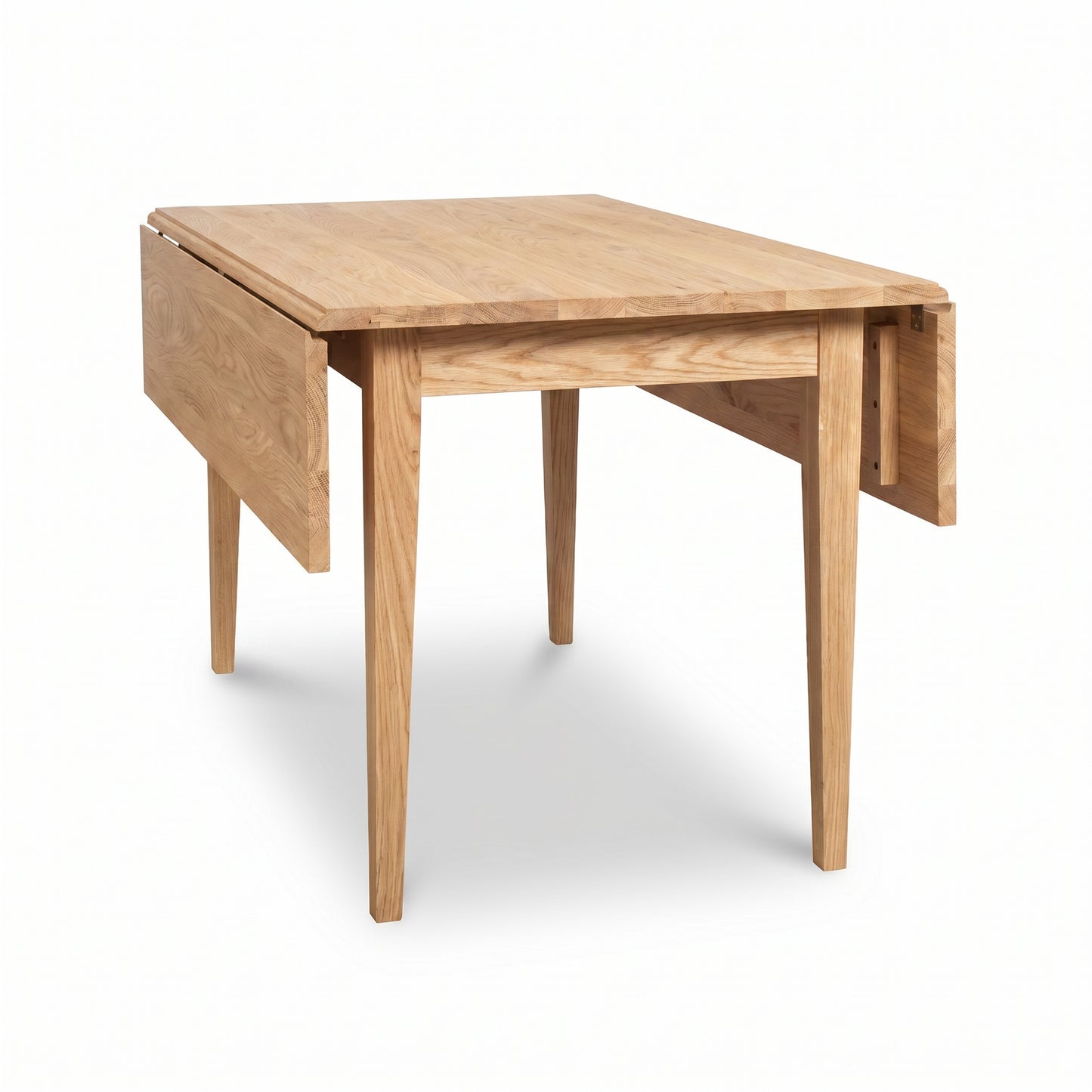 Lyndon Furniture Drop Leaf Table featuring one leaf extended and one folded, expertly crafted in Vermont from solid wood.