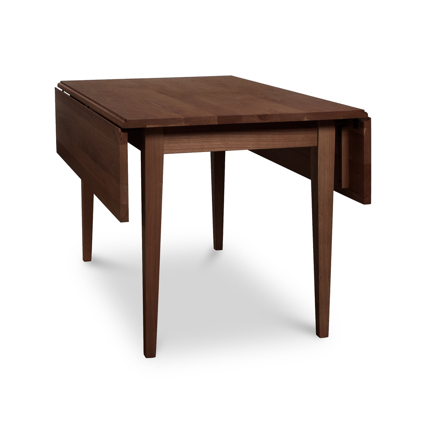 Lyndon Furniture Drop Leaf Table in natural cherry with one leaf extended, showcasing its handcrafted woodwork and elegant design.