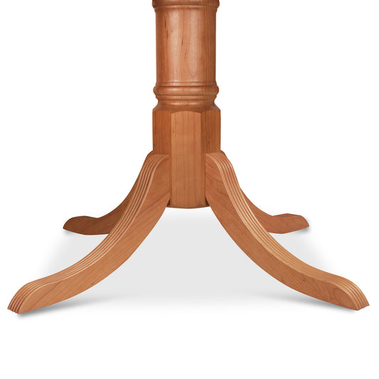 Duncan-Phyfe Round Pedestal Dining Table by Lyndon Furniture with four elegant curved legs in classic traditional design.