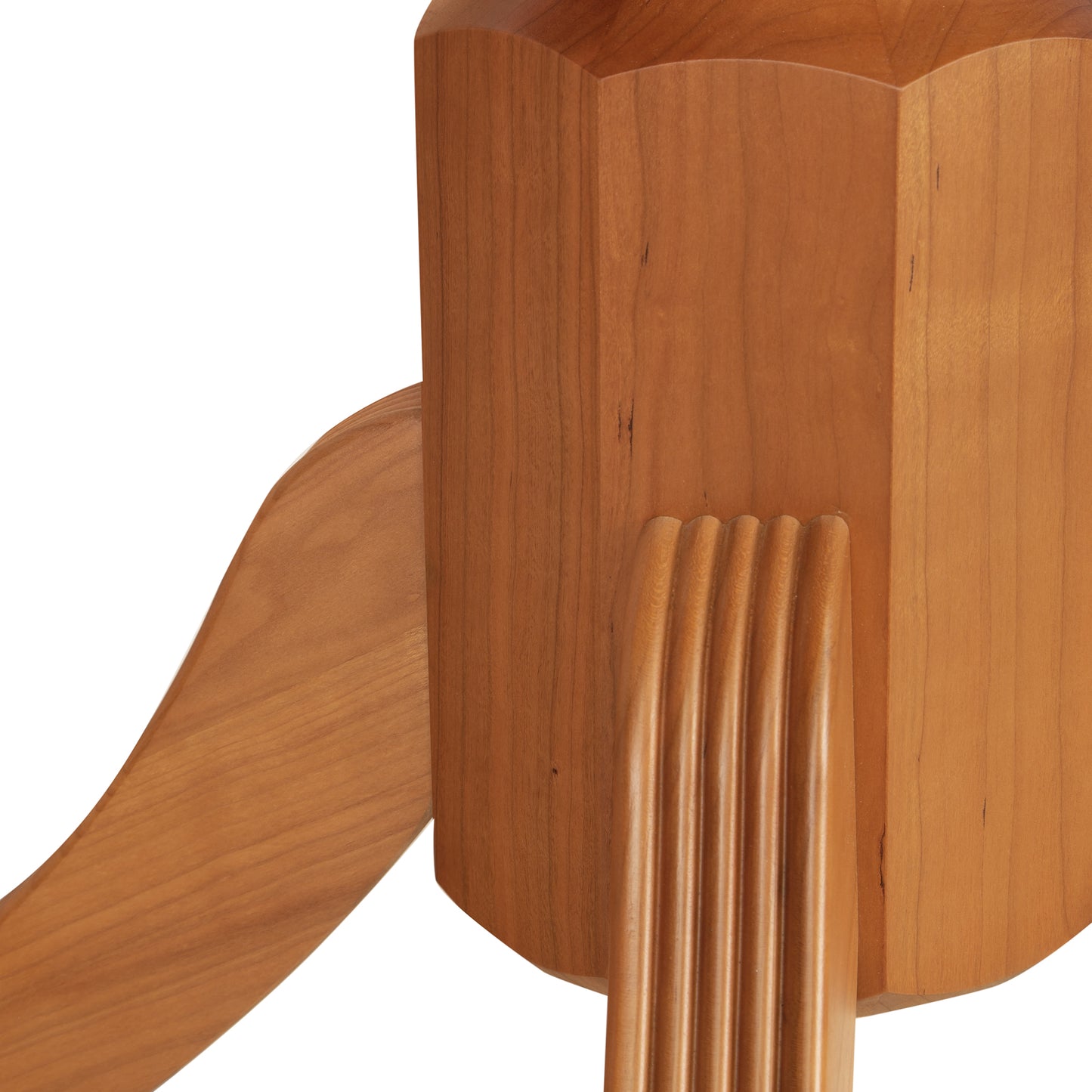 Duncan-Phyfe dining table by Lyndon Furniture, showcasing smooth light brown hardwood, grooved joints, and elegant pedestal foot design.