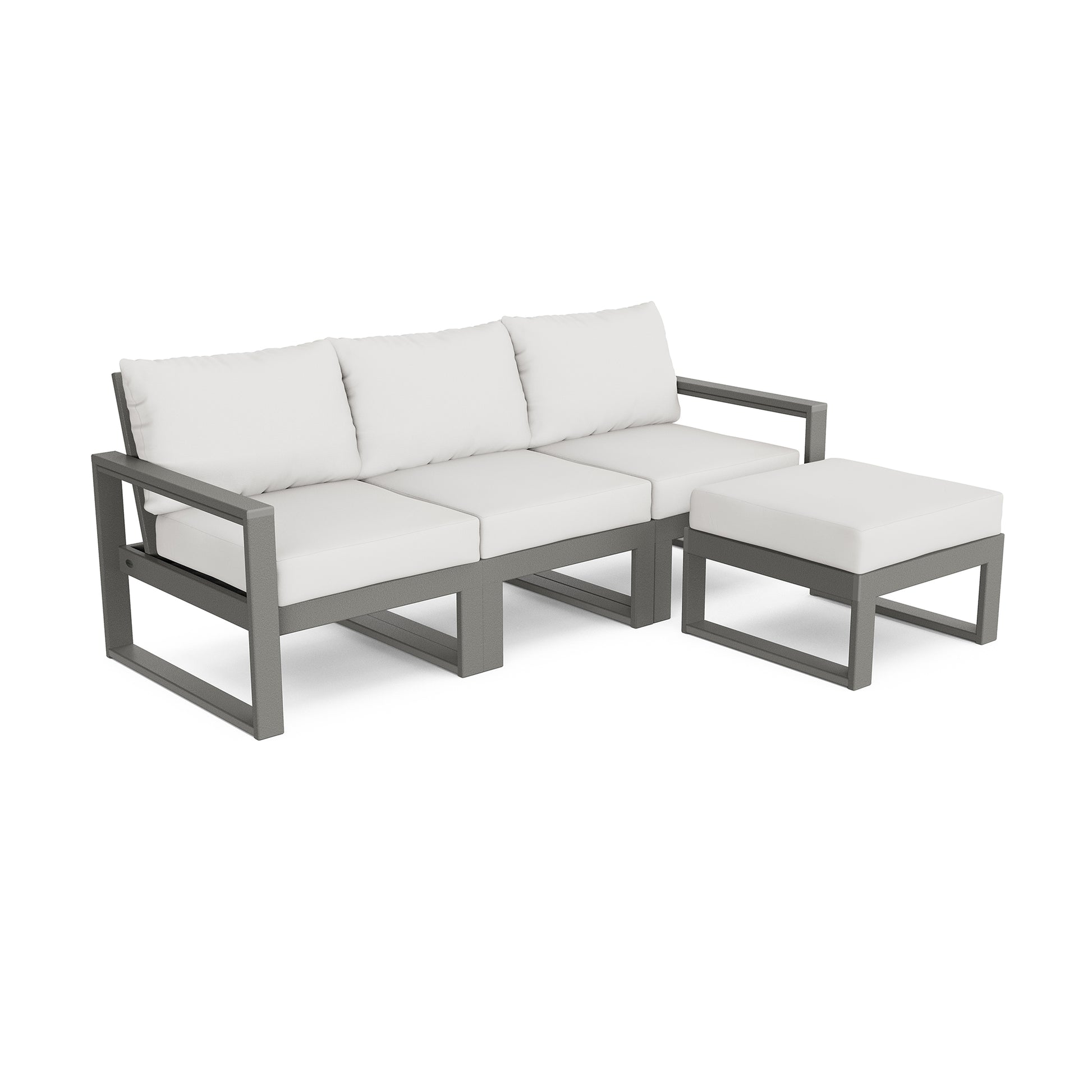 A modern POLYWOOD EDGE modular outdoor seating set featuring a gray aluminum frame with white cushions. The set includes a three-seat sofa and a matching ottoman, isolated on a white background.