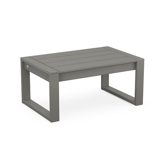 A simple, modern POLYWOOD EDGE Coffee Table in gray with a slatted top design and sturdy rectangular legs. The build appears to be of durable, weather-resistant POLYWOOD lumber.