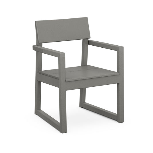 A simplistic modern outdoor dining chair with a solid gray color, featuring straight lines and angles. The POLYWOOD EDGE Dining Arm Chair has a flat seat, a straight backrest, and armrests, all presented against a white.