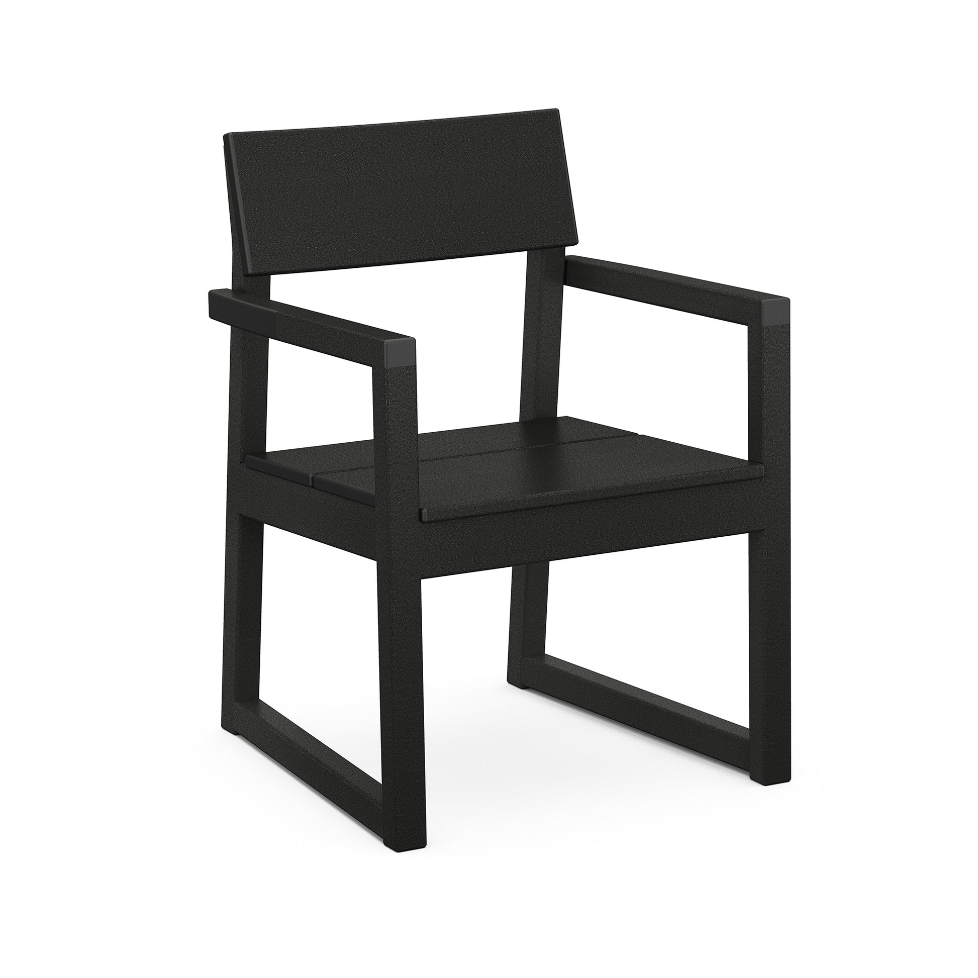 A modern, matte black POLYWOOD EDGE Dining Arm Chair with a minimalist design, featuring a square seat and backrest, and sturdy frame that’s slightly angled for support using marine-grade hardware.