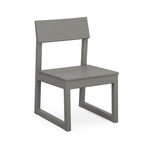 A simple, modern outdoor dining chair with a straight, uniform design in gray color. The POLYWOOD EDGE Dining Side Chair features a flat seat, a straight backrest, and a sturdy frame made of angled legs with marine-grade.