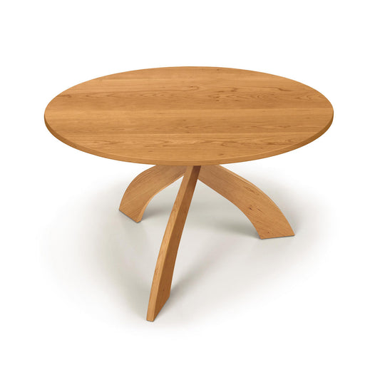 Entwine Round Solid Top Table by Copeland Furniture with cherry wood finish and three curved legs, American made and expertly crafted.