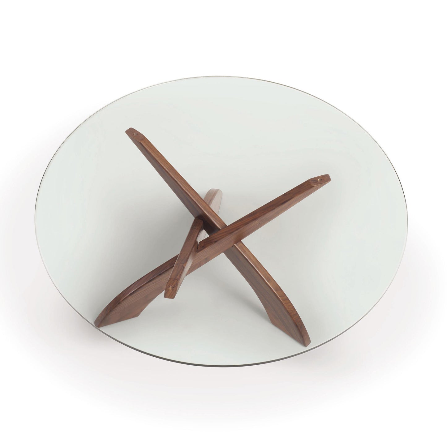 A high-end Entwine Walnut Round Coffee Table - Ready to Ship from Copeland Furniture with a wooden cross on top.