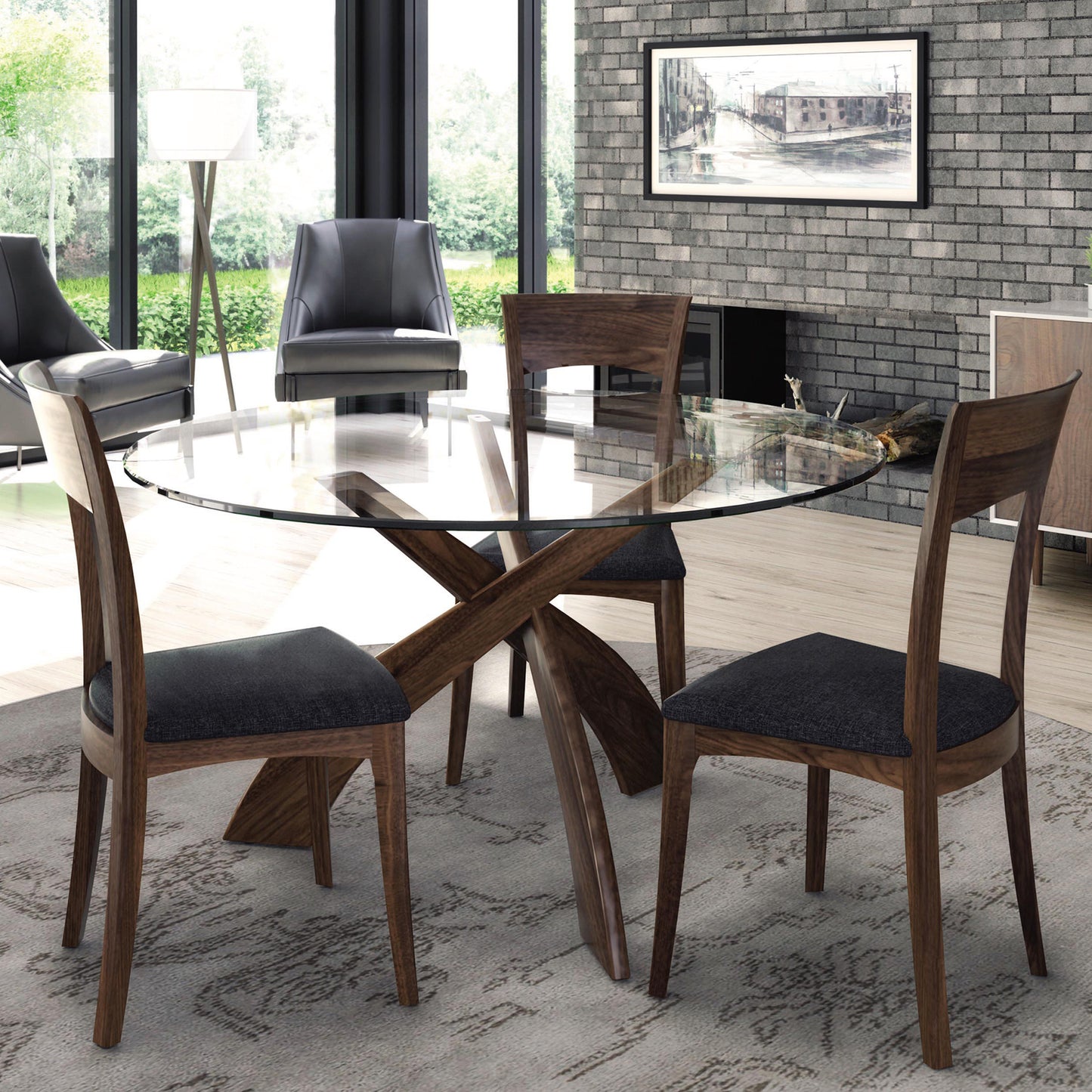 Copeland Entwine round glass top dining table with three wooden chairs featuring dark cushions, showcasing elegant craftsmanship and contemporary design.
