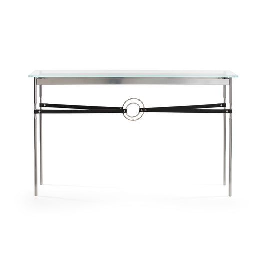 Equus Console Table by Hubbardton Forge with a glass top, sleek metal legs, and handcrafted circular metal accent.