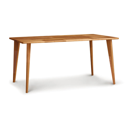 A simple, eco-friendly Essentials Dining Table with Wood Legs from Copeland Furniture, with four legs and a rectangular top, isolated on a white background.