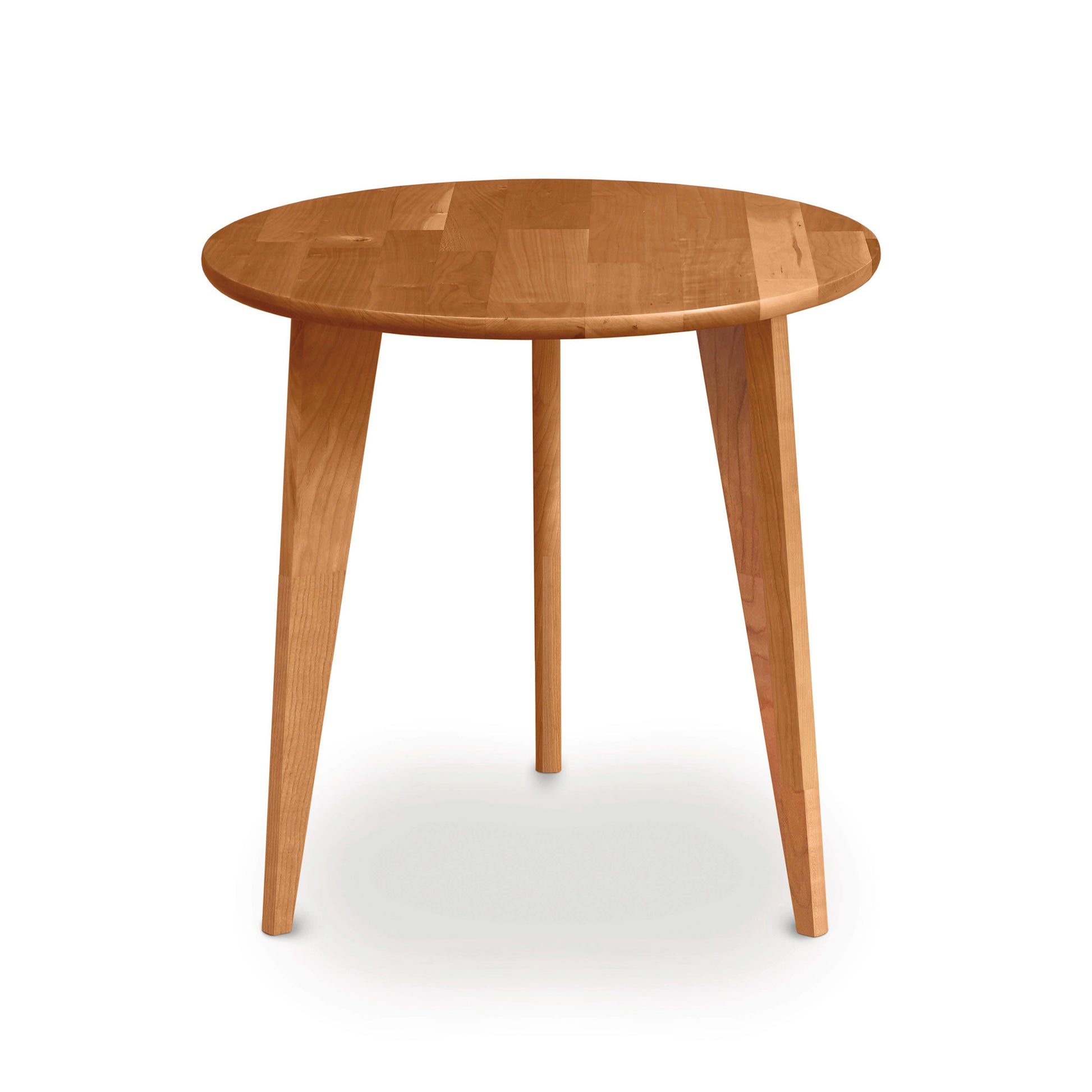 A mid-century modern Essentials Round End Table with Wood Legs from Copeland Furniture, isolated on a white background.