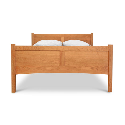 Essex High Footboard Bed by Vermont Furniture Designs, showcasing its tall headboard and footboard in quality hardwood, accented by two white pillows.