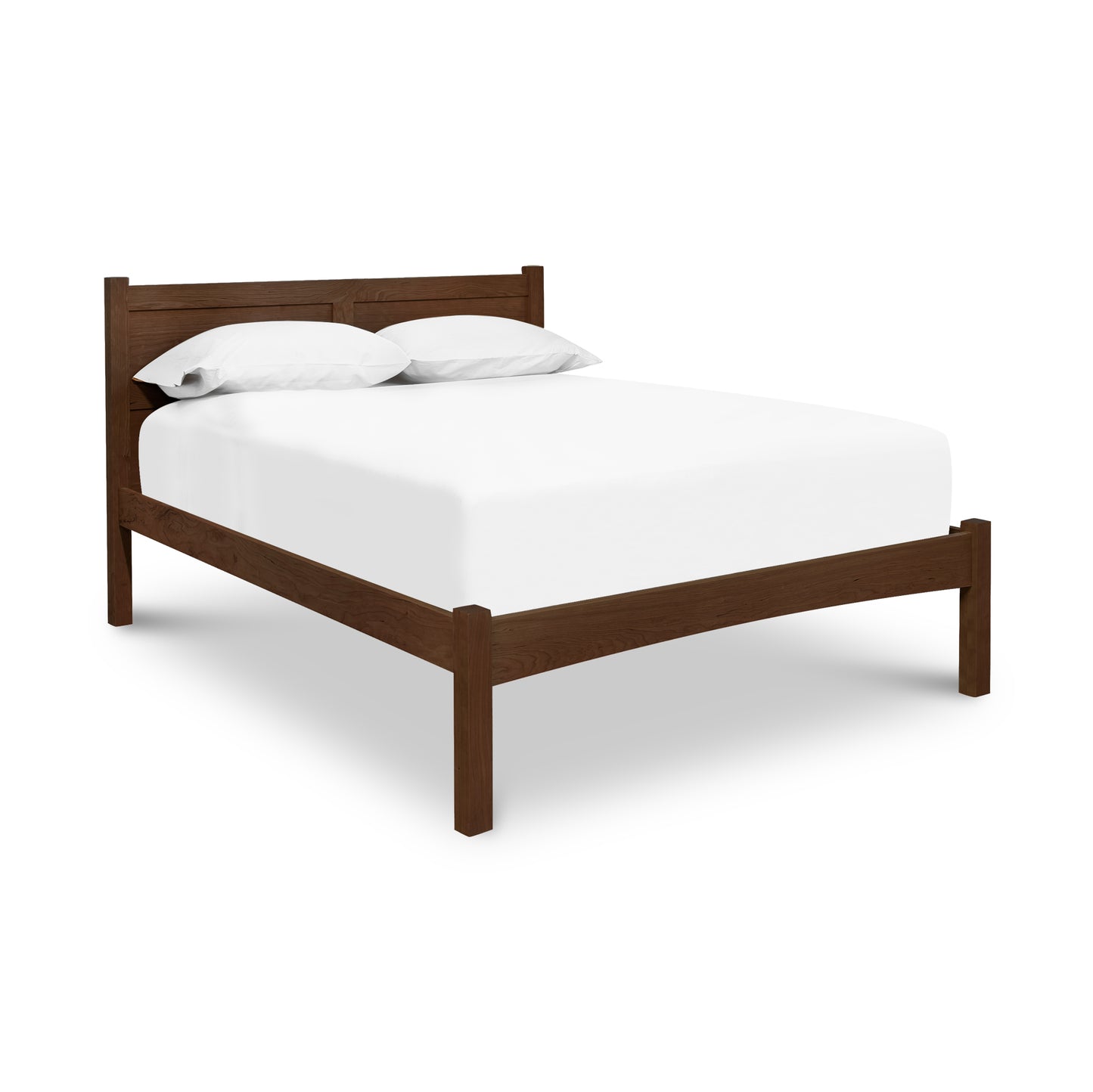 A cherry wood Vermont Furniture Designs Essex Low Footboard Bed frame with a white mattress and pillows on a white background.