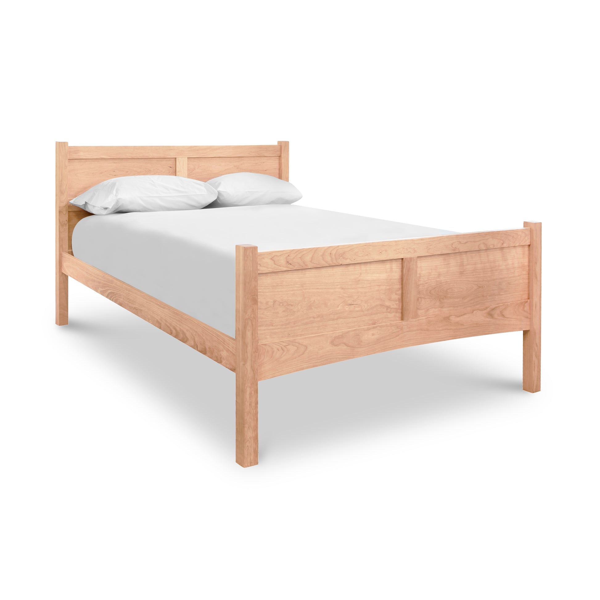 A cherry wood Vermont Furniture Designs Essex High Footboard Bed with a headboard, featuring a white sheet and two pillows, isolated on a white background.