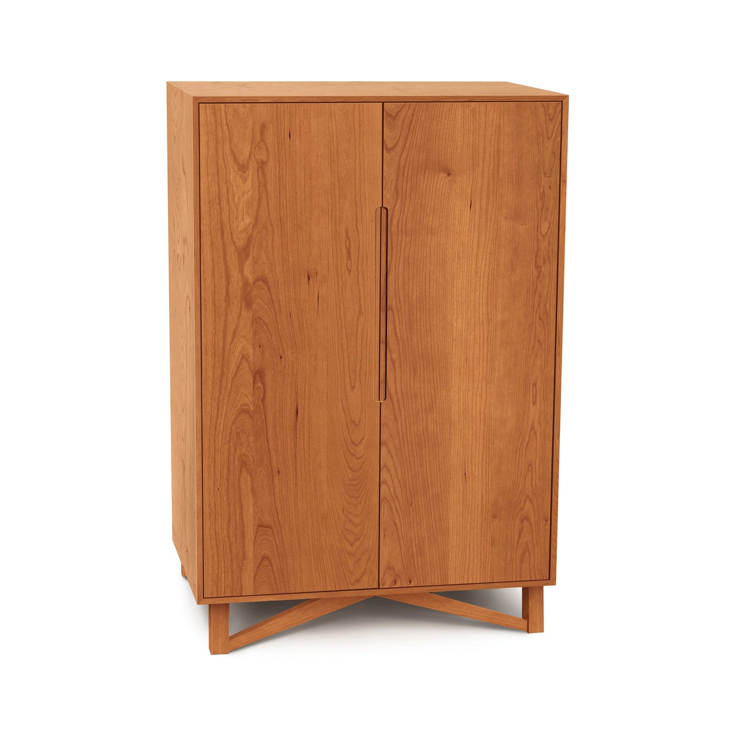 Medium Exeter Bar Cabinet by Copeland Furniture with two doors, elegant handles, and a distinctive crisscross base in mid-century modern design.