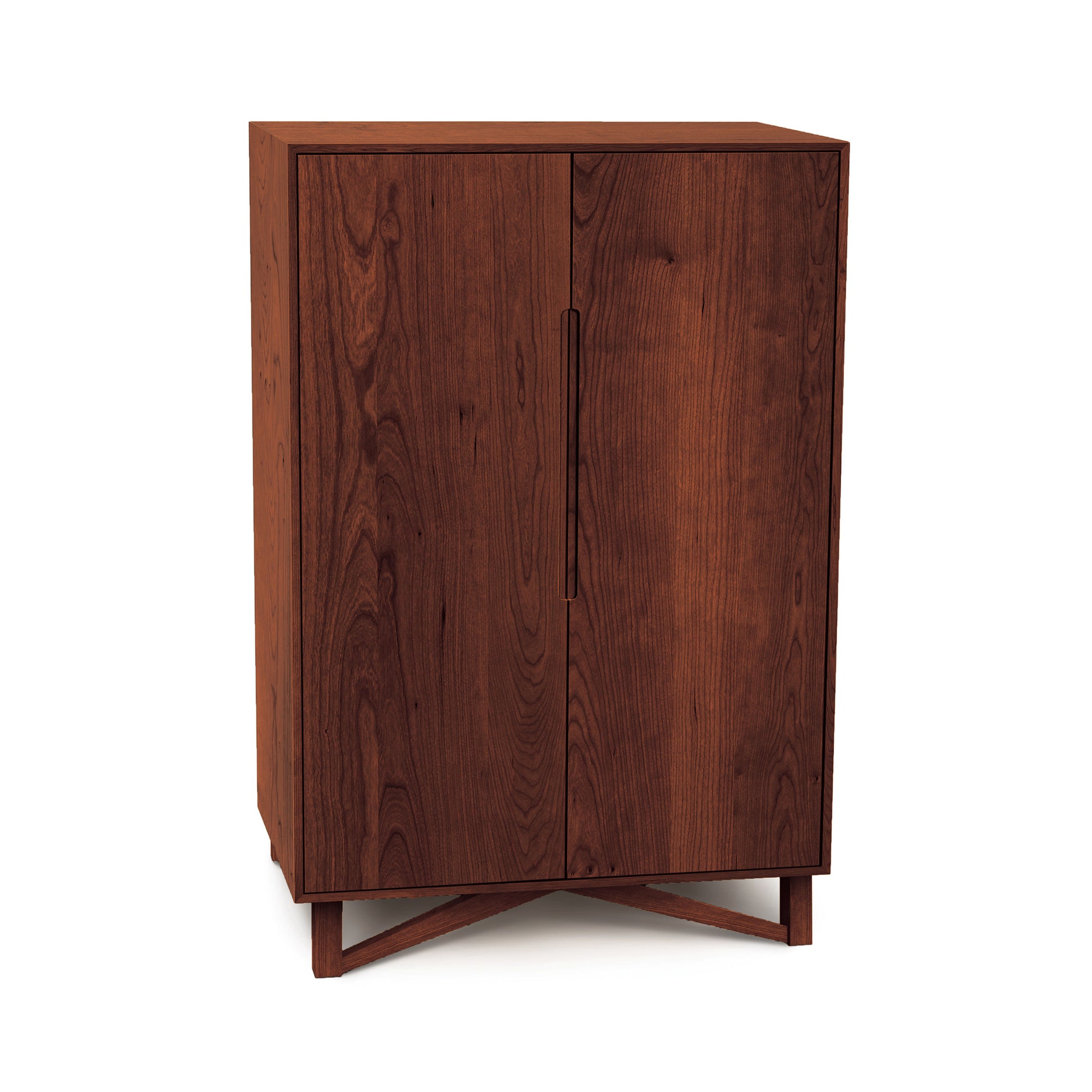 Exeter Bar Cabinet by Copeland Furniture, tall and rectangular with two doors and a cross base, finely handcrafted in wood.