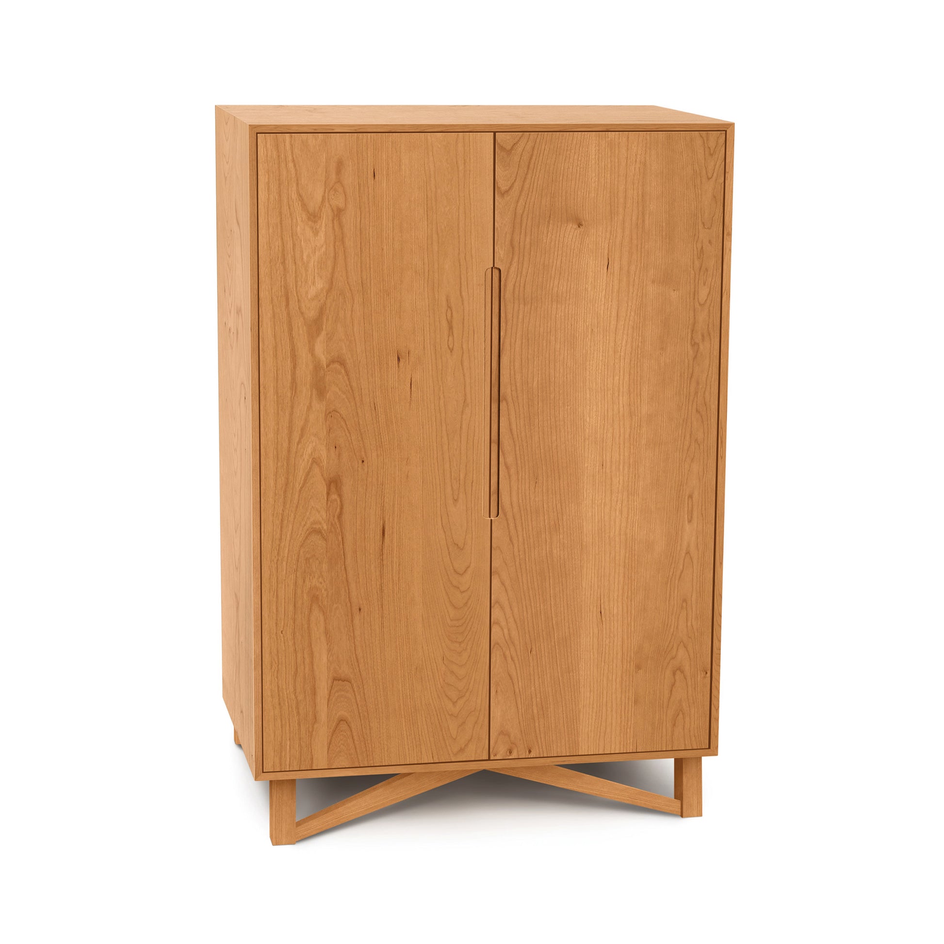 Exeter Bar Cabinet by Copeland Furniture with two doors and a modern crisscross base, highlighting its elegant design.