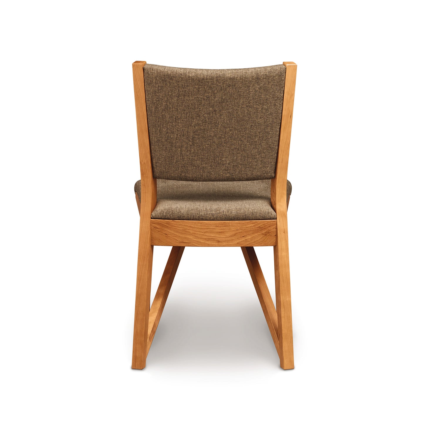An Exeter Chair from Copeland Furniture featuring a brown upholstered seat and backrest, isolated against a white background, emanates modern style from the Exeter Furniture Collection.