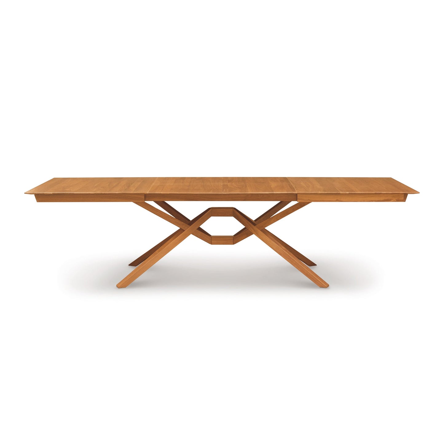 A wooden table with a cross leg on it.