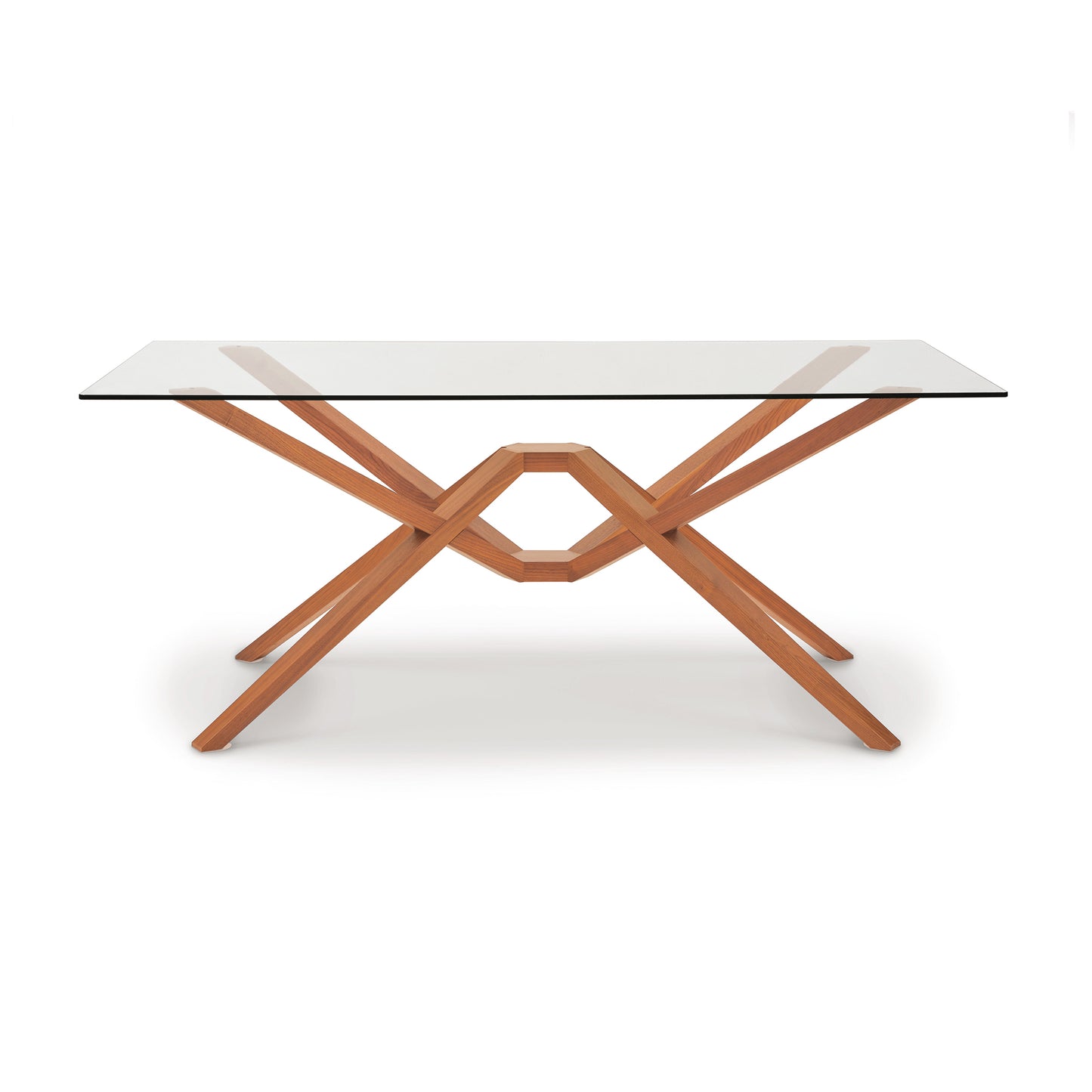 A modern Copeland Furniture Exeter Rectangular Glass Top Table with a solid wood x-shaped base on a white background.