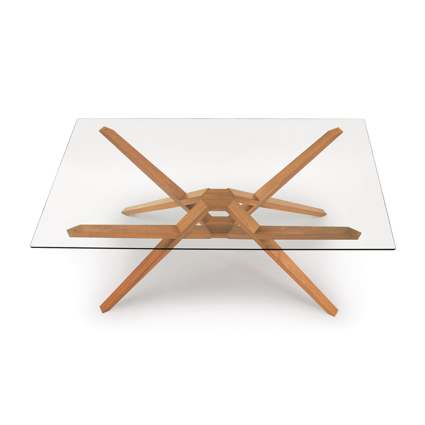 Exeter Rectangular Glass Top Table by Copeland Furniture with modern angled hardwood legs, highlighting craftsmanship and sleek design.