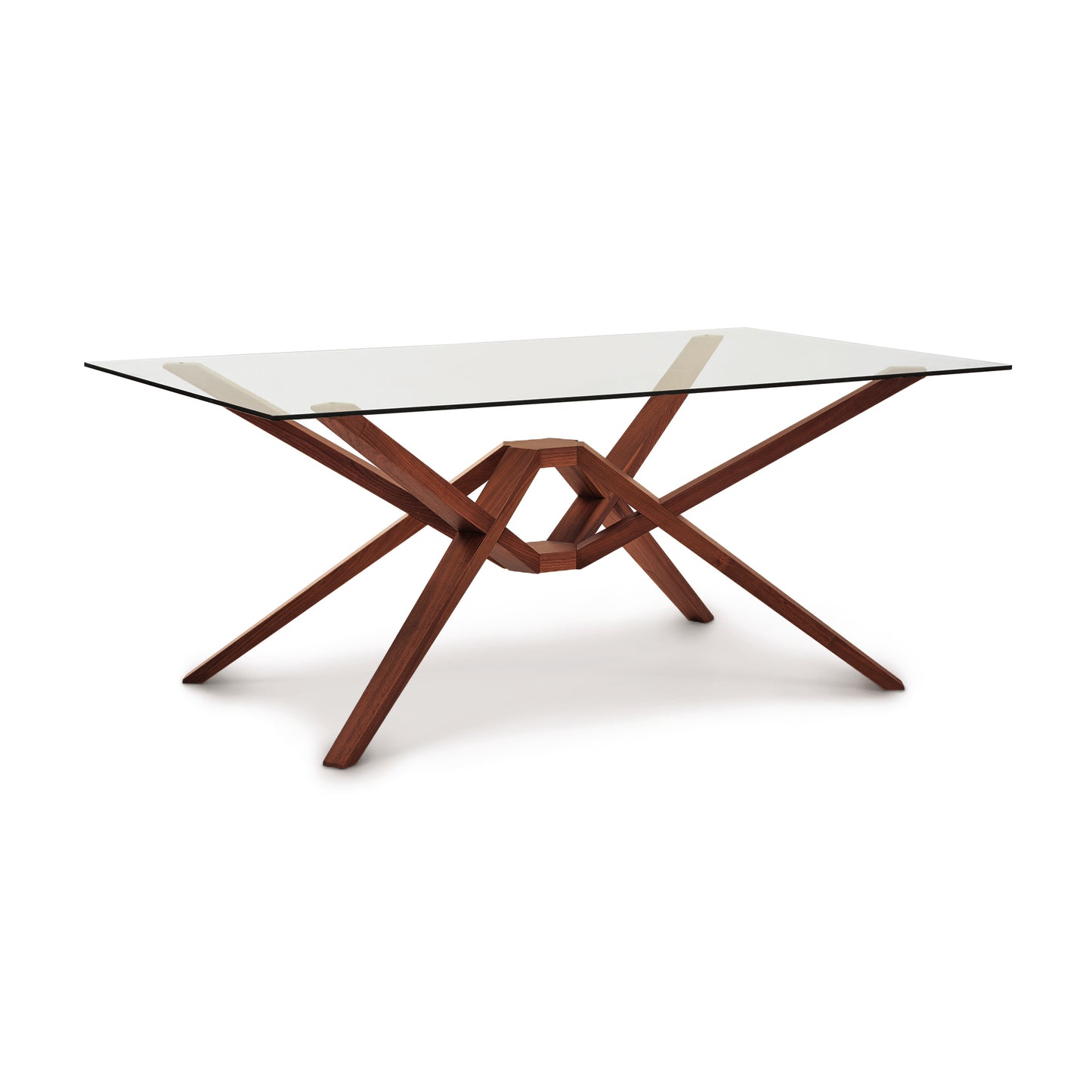 Exeter Rectangular Glass Top Table by Copeland Furniture with a solid wood, geometric base and intersecting angled legs, showcasing modern craftsmanship.
