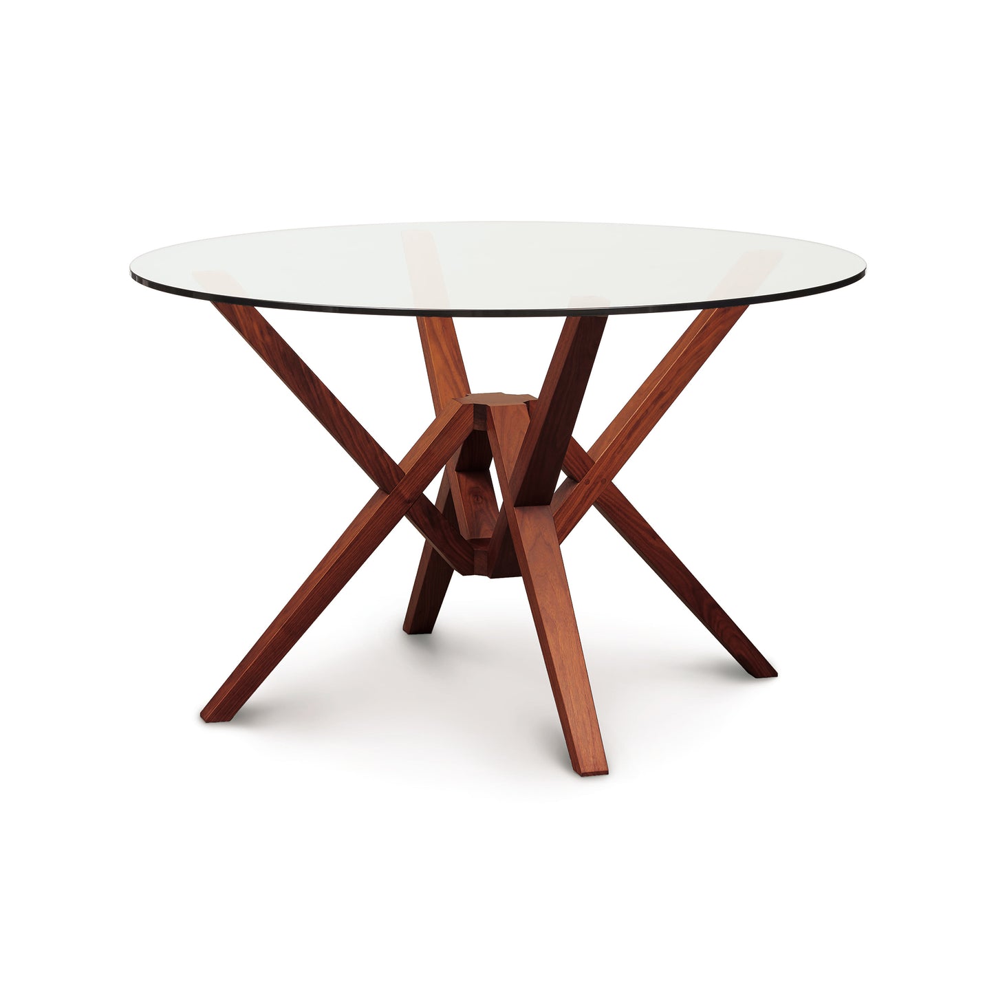 Exeter Round Glass Top Table by Copeland Furniture featuring a striking geometric hardwood base with intersecting legs and a clear round glass tabletop.