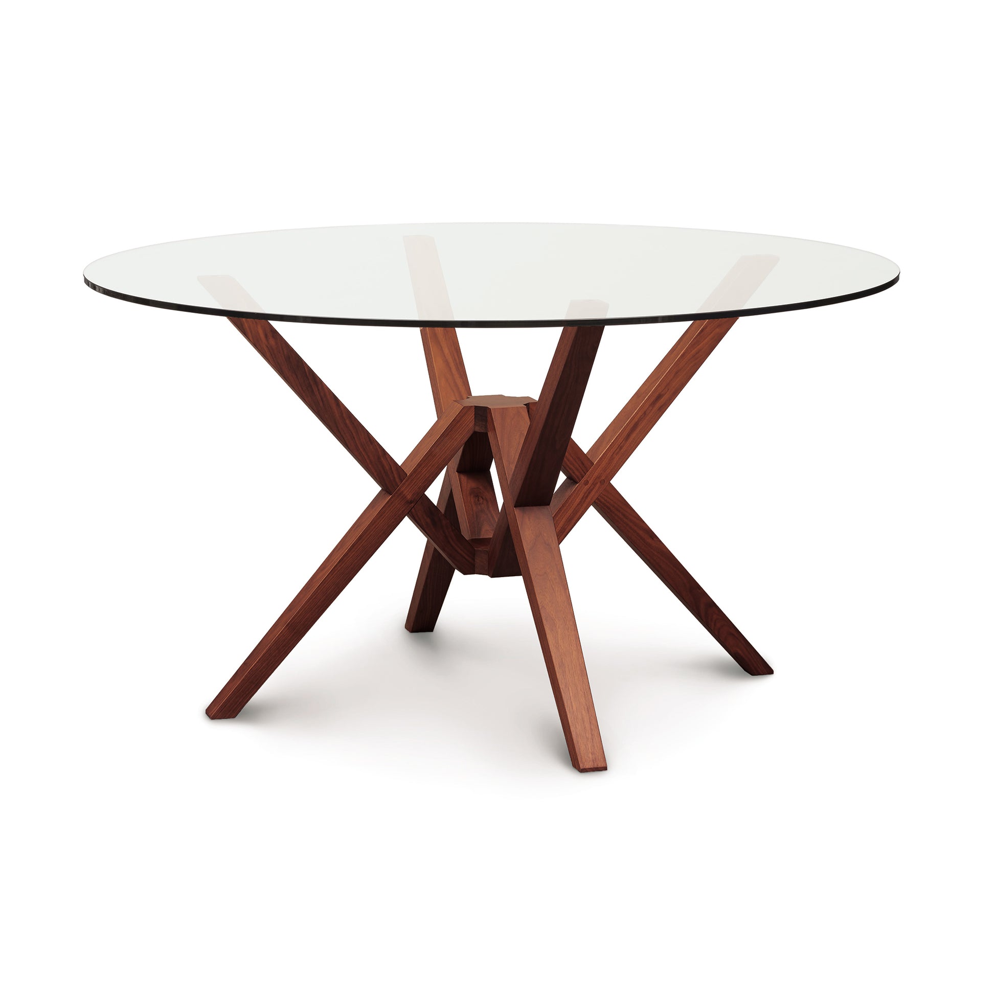 Exeter Round Glass Top Table by Copeland with striking geometric hardwood base and clear circular glass top, showcasing modern craftsmanship.