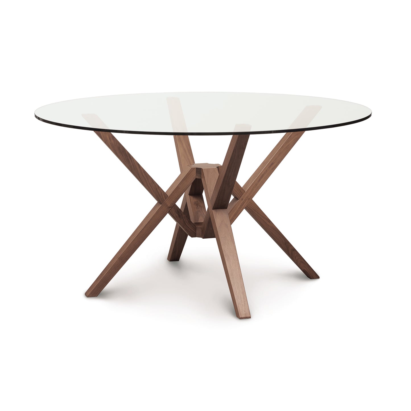 An Copeland Furniture Exeter Round Glass Top Dining Table with a solid wood base crafted from sustainably harvested hardwoods.