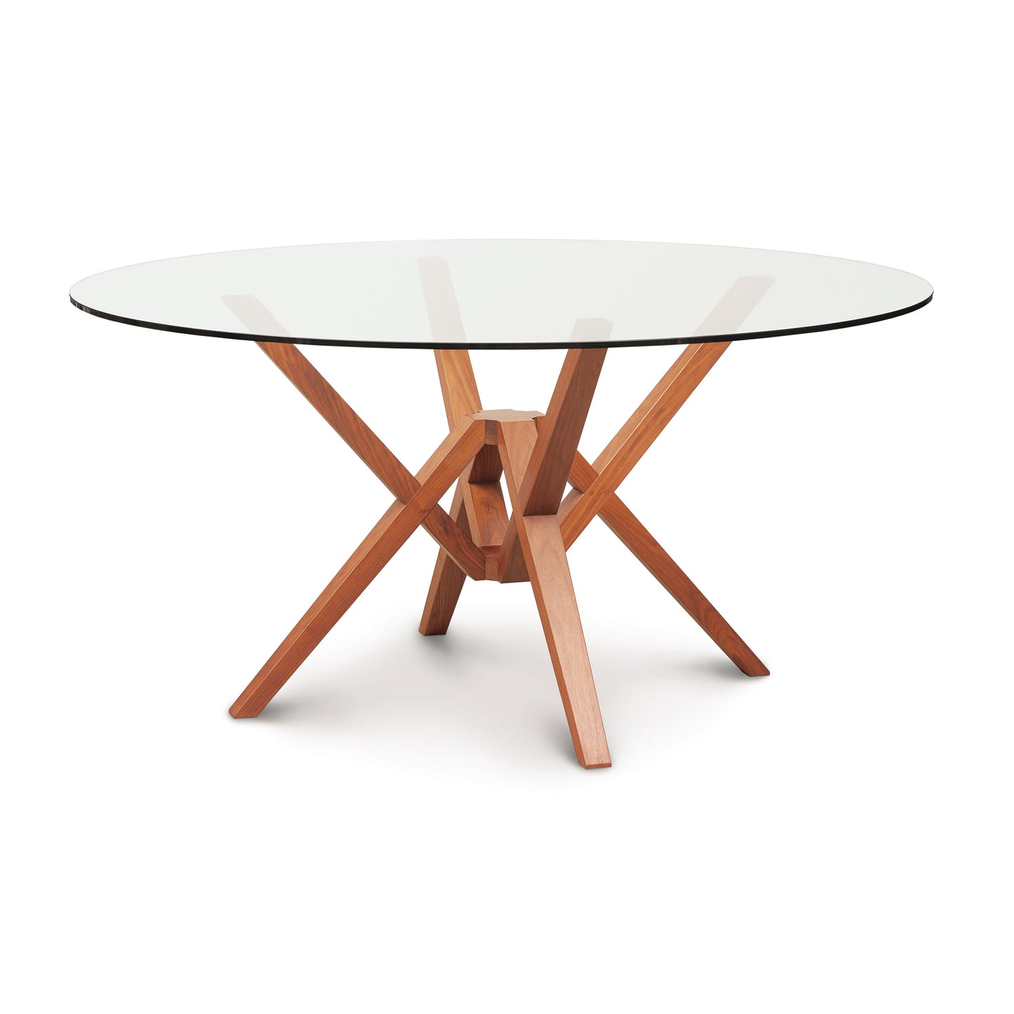 An Copeland Furniture Exeter Round Glass Top Table with a solid wood base featuring an intersecting support design crafted from sustainably harvested hardwoods.