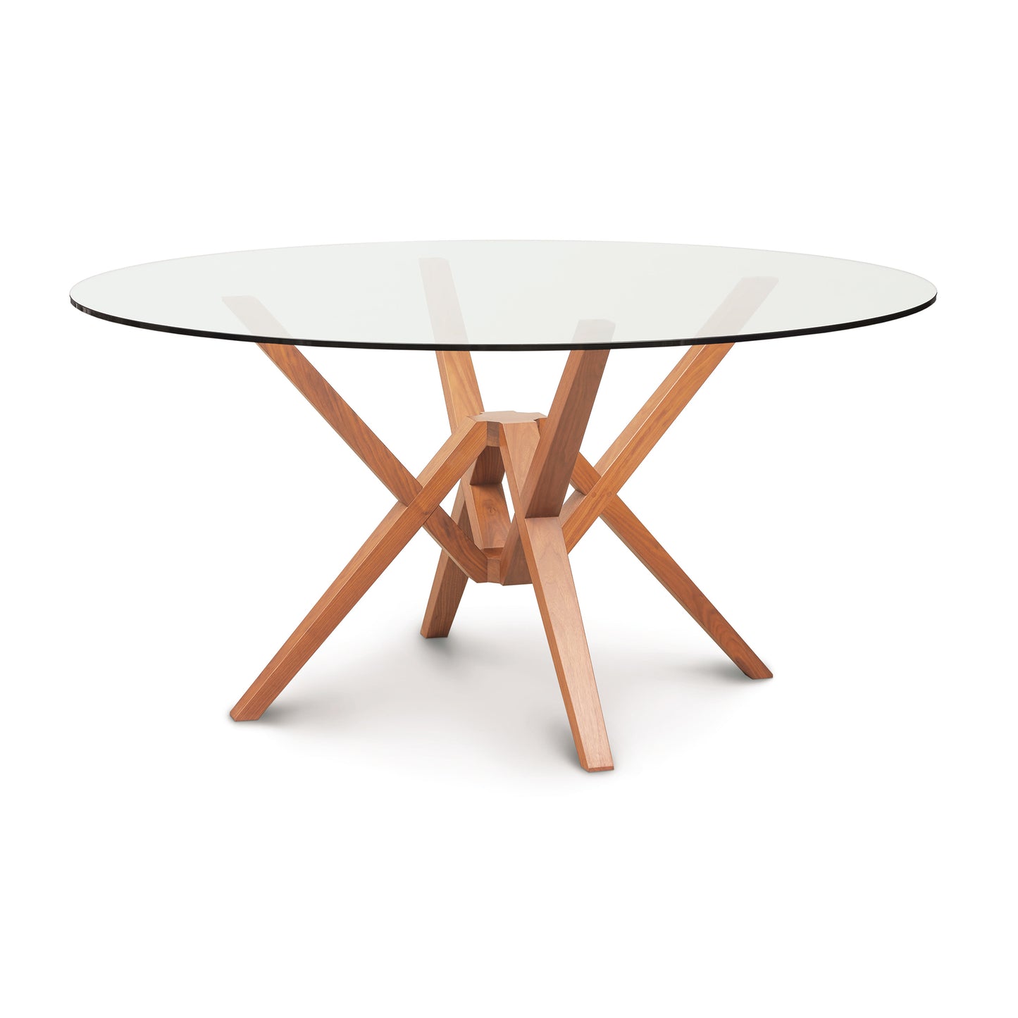 A modern Copeland Furniture Exeter Round Glass Top Dining Table with a solid wood base crafted from sustainably harvested hardwoods.