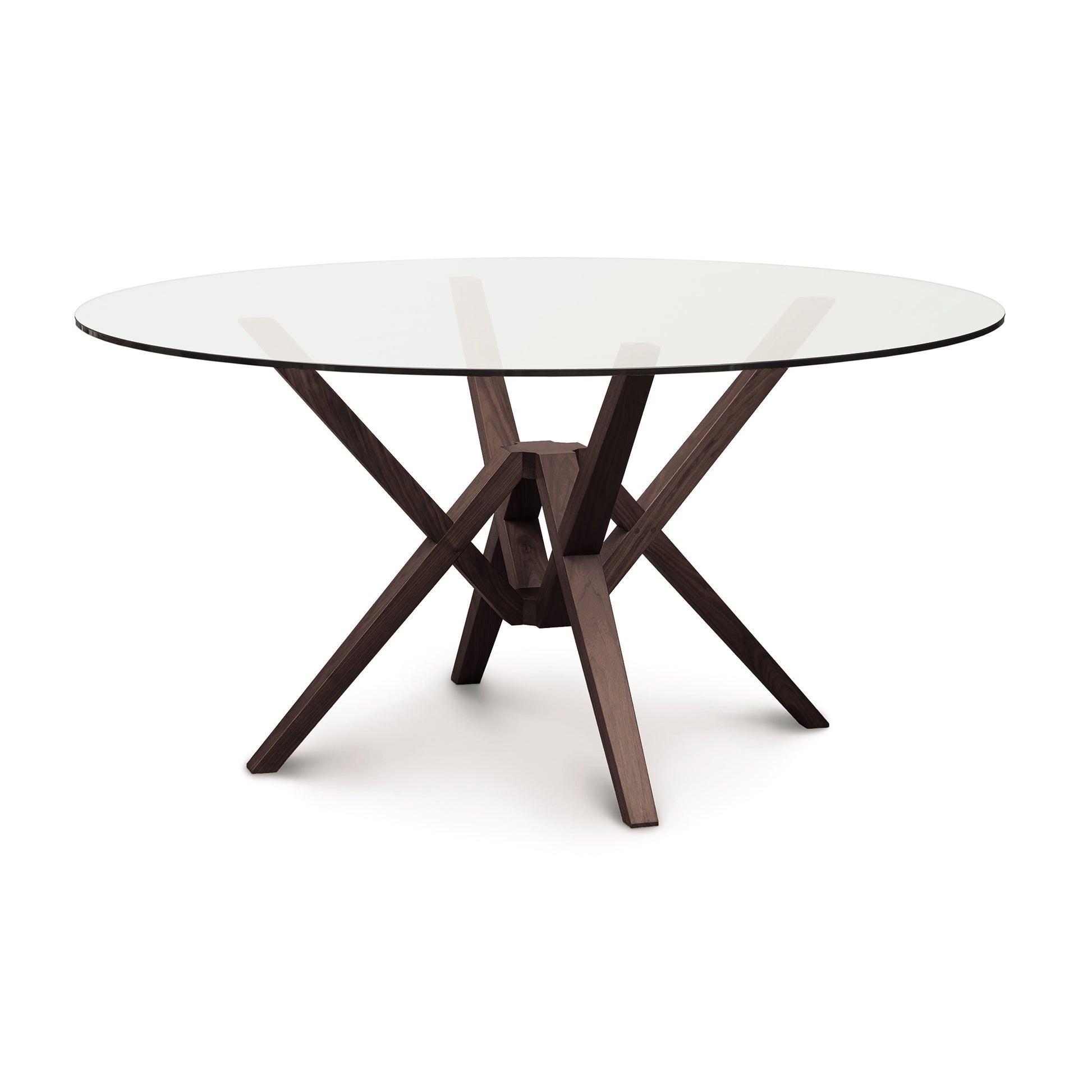 Exeter Round Glass Top Table by Copeland Furniture featuring a sculptural isometric hardwood base and clear round glass tabletop.