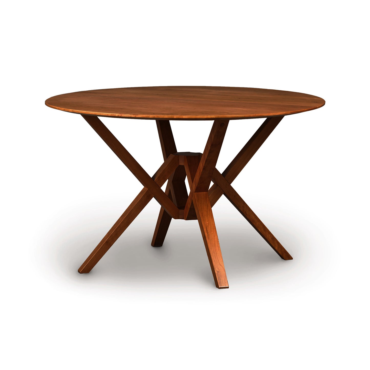 Exeter Round Solid Top Dining Table by Copeland Furniture with distinctive intersecting hardwood legs and a smooth, solid wood surface.