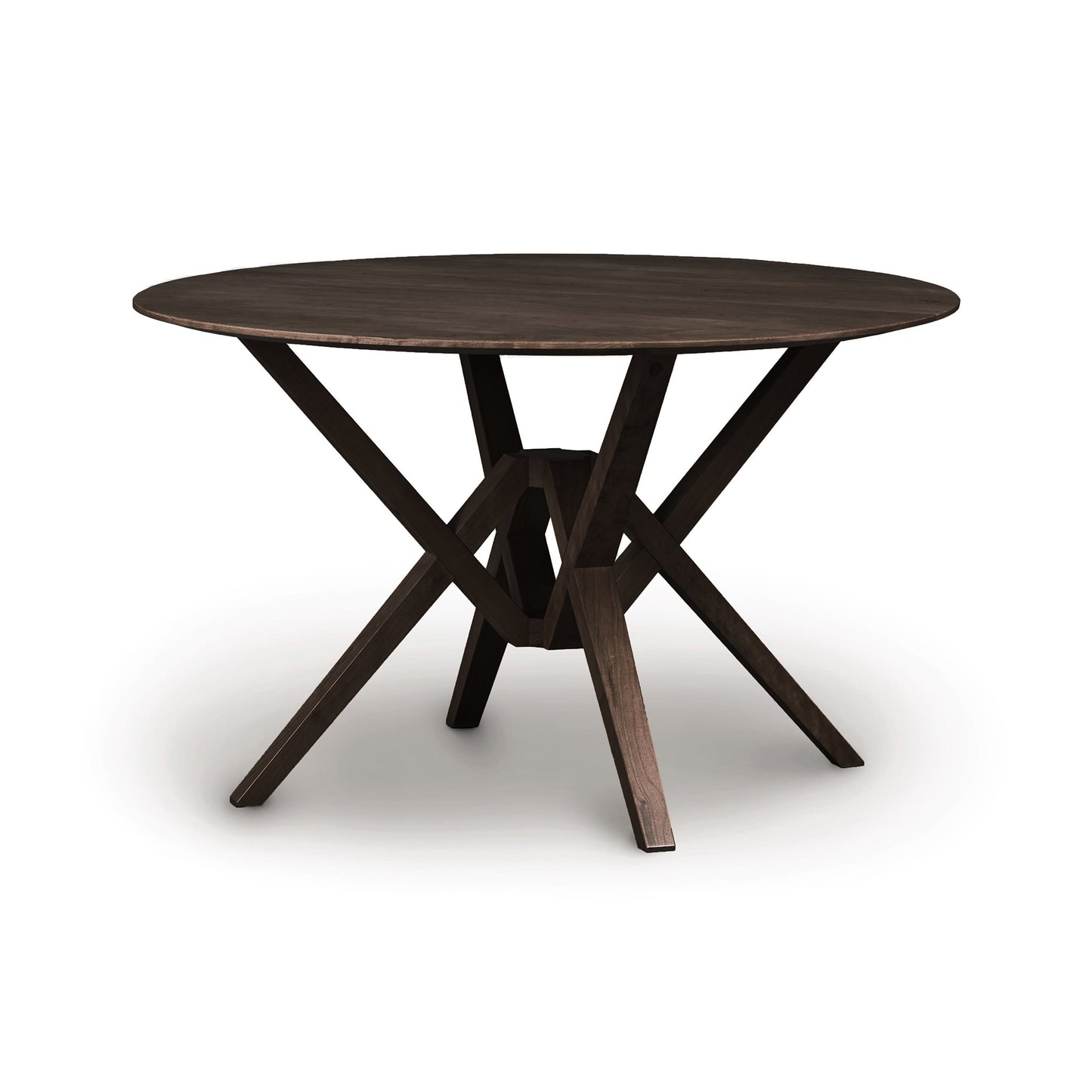 Exeter Round Solid Top Dining Table by Copeland Furniture with distinctive intersecting legs in a rich, dark hardwood finish, highlighting its elegant American craftsmanship.