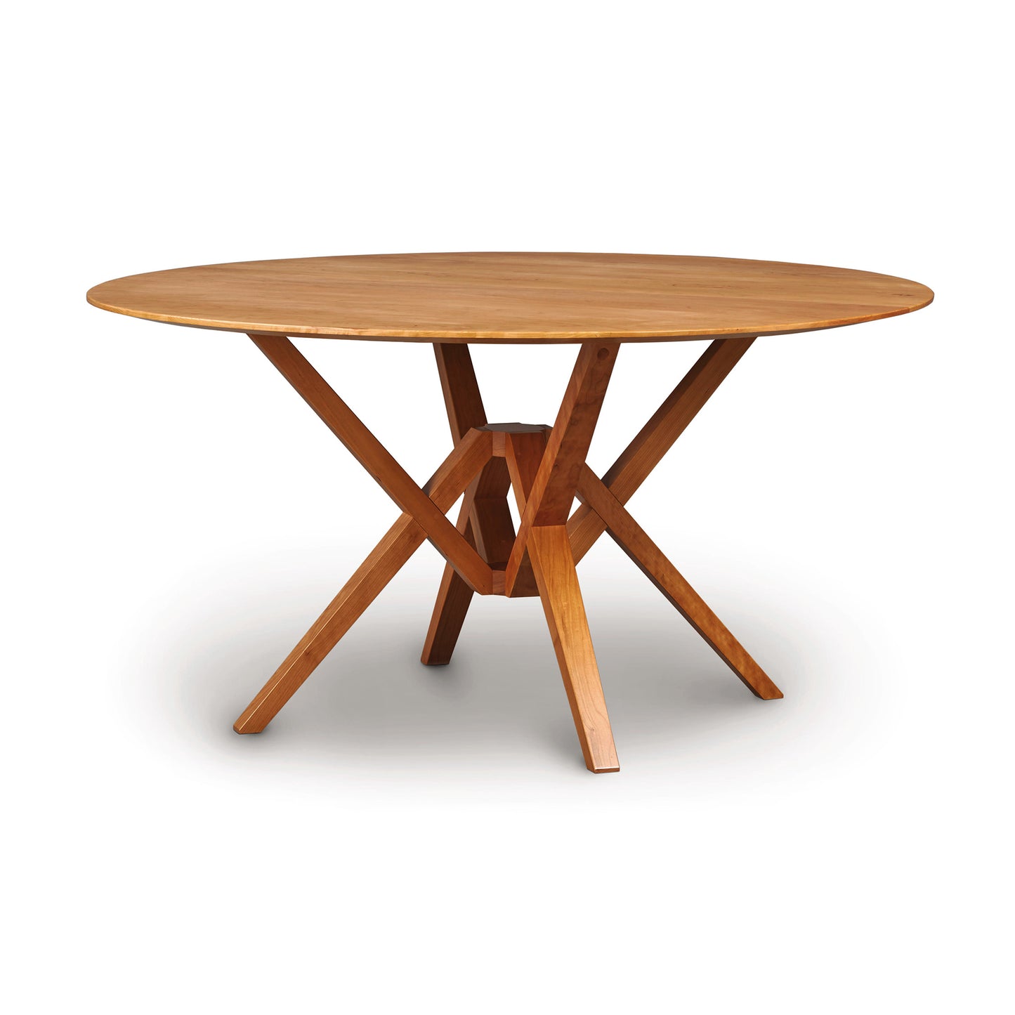 Copeland Exeter Round Solid Top Dining Table with a smooth solid wood surface and distinctive geometric base, crafted from high-quality wood.
