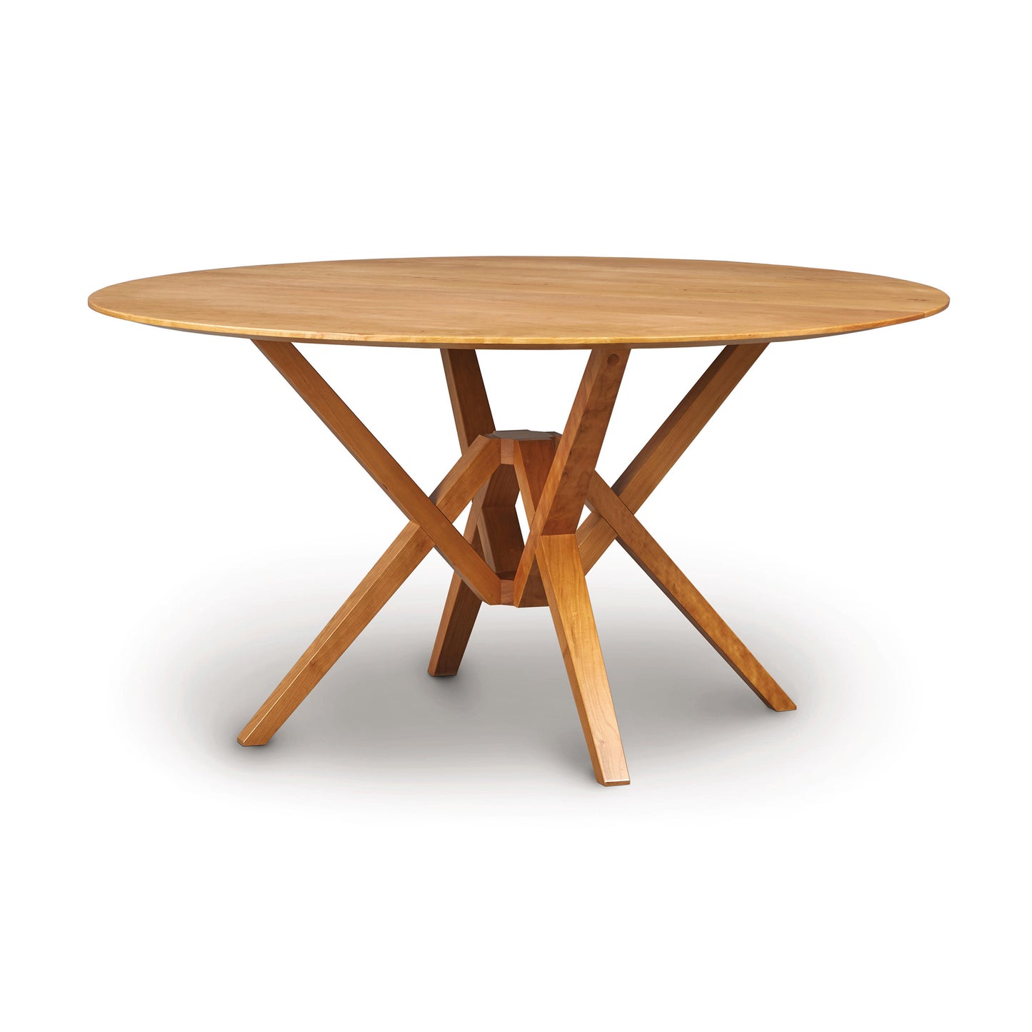 Exeter Round Solid Top Dining Table by Copeland Furniture, showcasing natural hardwood and distinctive geometric angled legs.