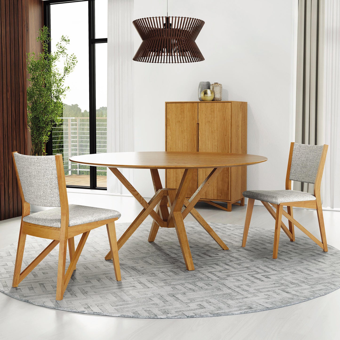 Copeland Furniture Exeter Round Solid Top Dining Table with two matching chairs, showcasing elegant craftsmanship and contemporary design.