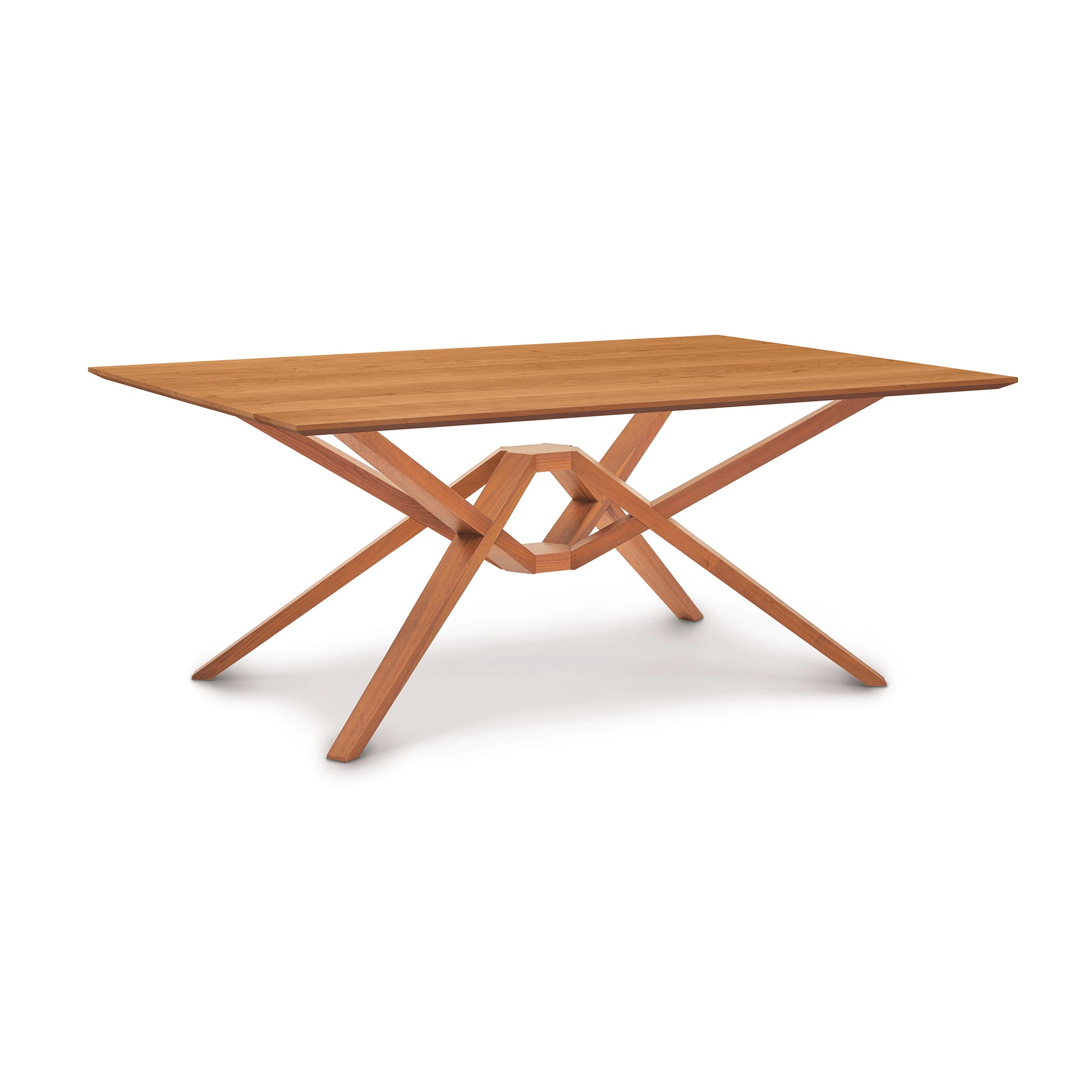 A Copeland Furniture Exeter Solid Top Dining Table with a unique intersecting leg design on a white background, crafted from sustainably harvested solid North American hardwood.