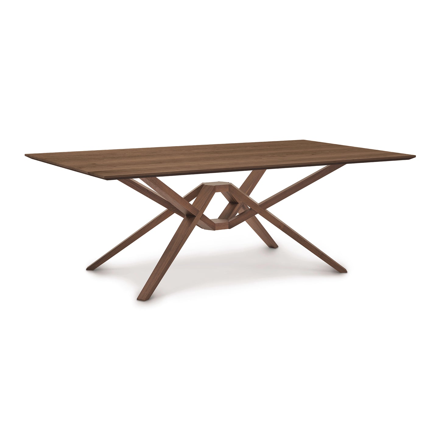 An Exeter Solid Top Dining Table by Copeland Furniture, featuring a unique crossed-leg design and crafted from sustainably harvested solid North American hardwood, set against a white background.