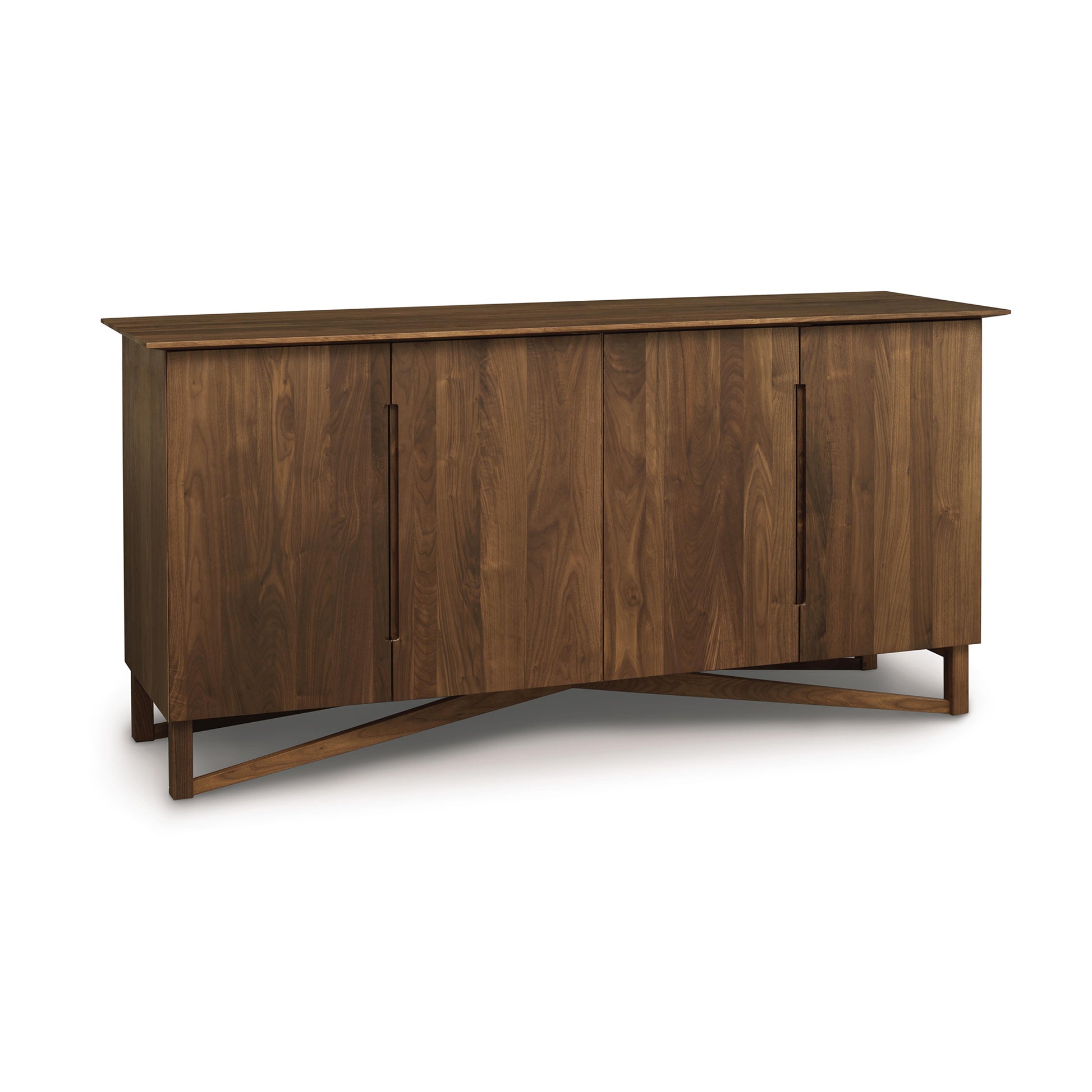 Copeland Exeter Buffet crafted from natural hardwood with four doors, flat top, and distinctive angled legs, showcasing modern design.