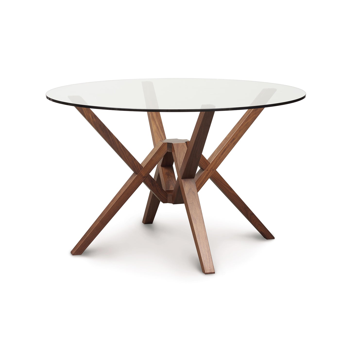 Exeter Round Glass Top Table by Copeland Furniture featuring a sculptural hardwood base and circular glass surface, showcasing modern American craftsmanship.