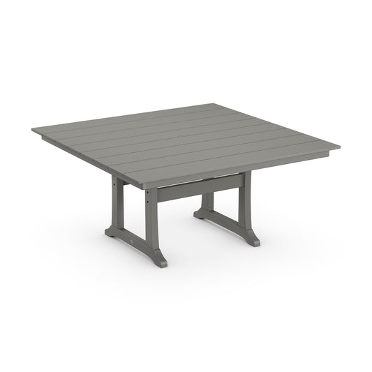 A low, square outdoor dining table with a slatted gray POLYWOOD Farmhouse Trestle 59" Dining Table top and sturdy dark gray metal legs, set against a plain white background.