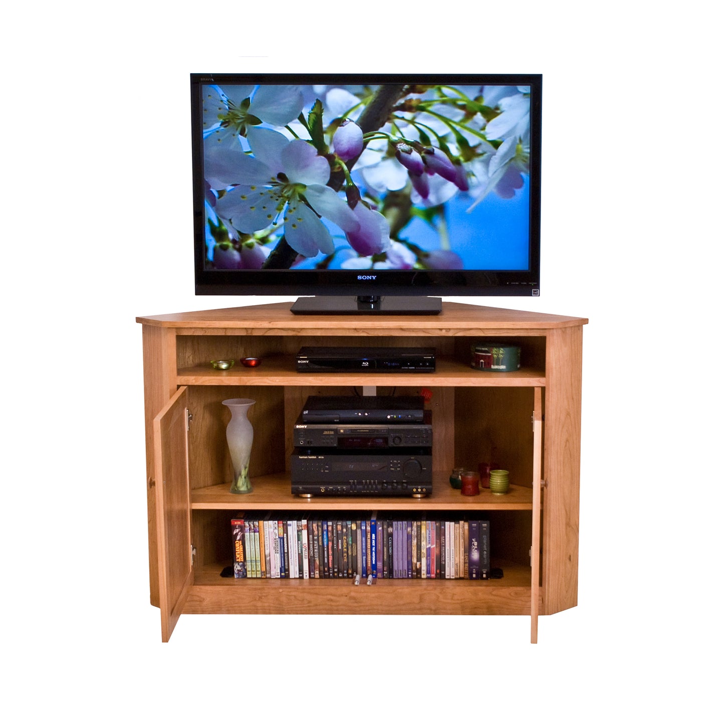 Lyndon Furniture Flat Screen Corner Entertainment Console with adjustable shelves, open doors, and TV display.