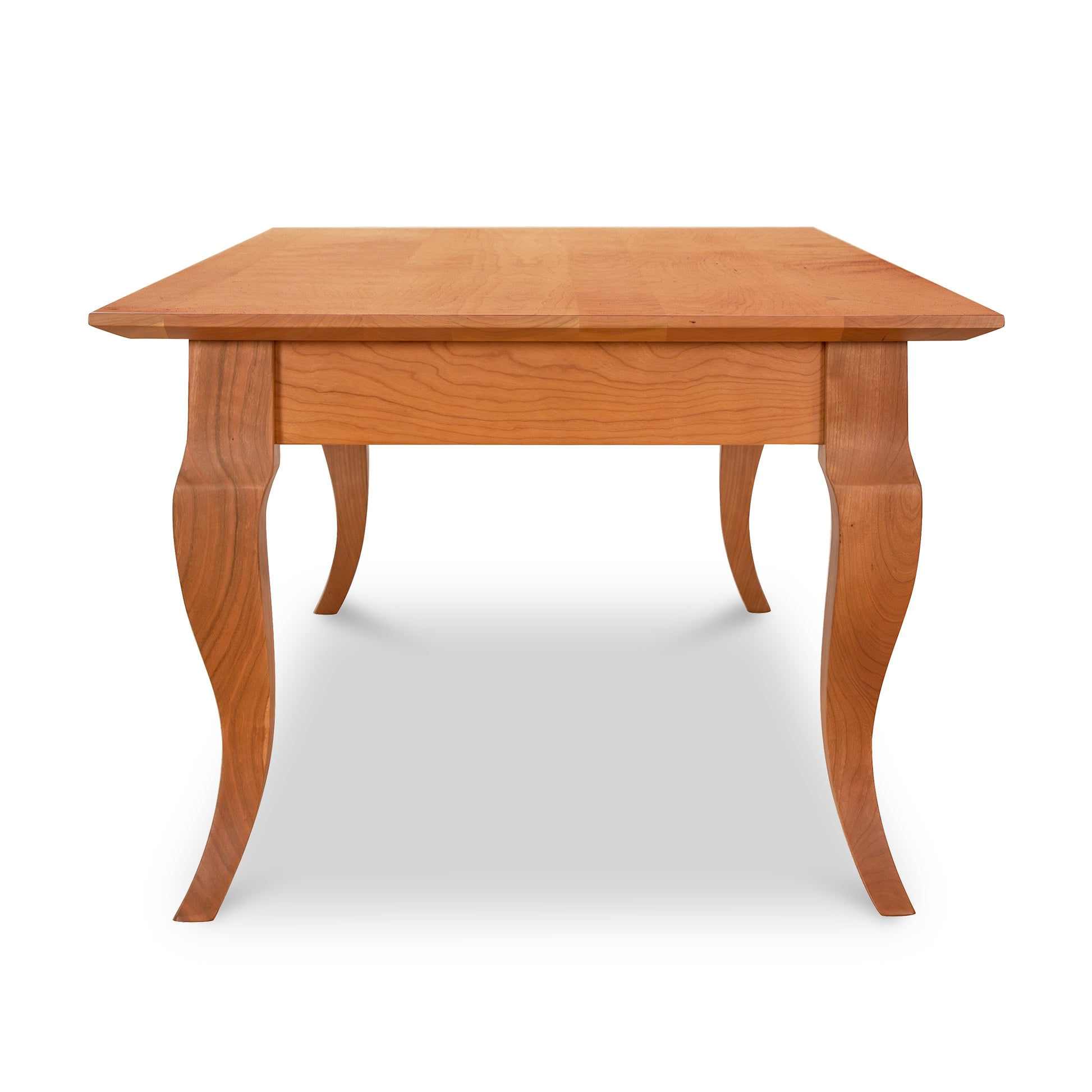 A French Country Coffee Table by Lyndon Furniture, with a curved leg.