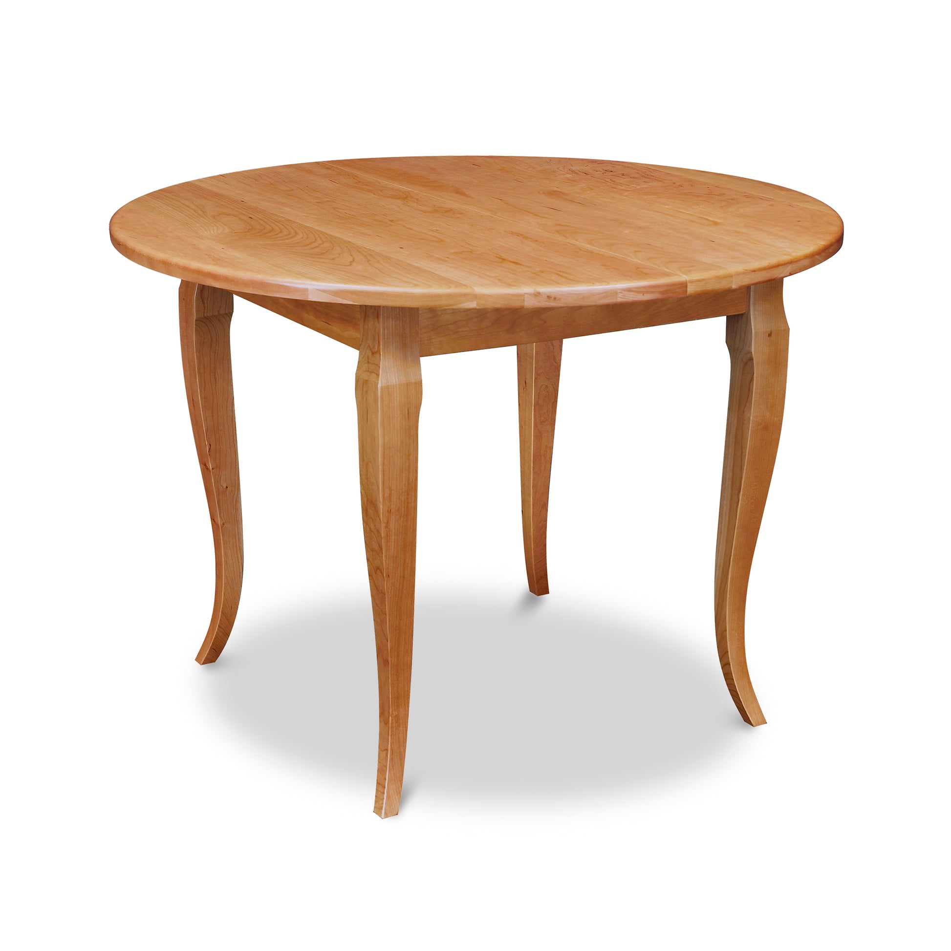 Lyndon Furniture French Country Round Table with four curved solid wood legs and a smooth solid top, handcrafted in sustainable American hardwood.