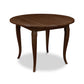 A French Country Round Solid Top Table with a wooden base, perfect for Lyndon Furniture-inspired interiors.