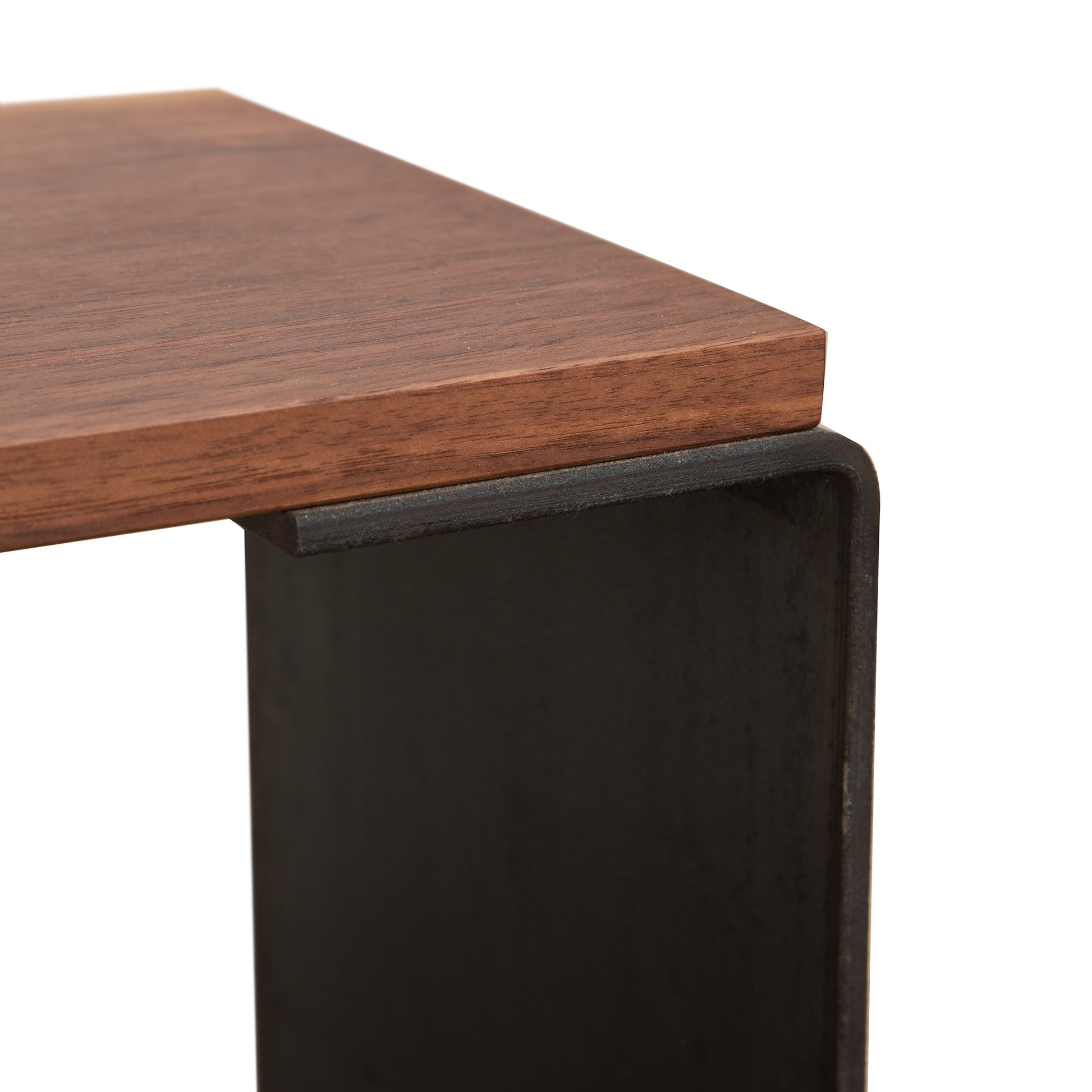 Vermont Woods Studios G Table showcasing a natural hardwood top and distinctive black metal geometric base design.