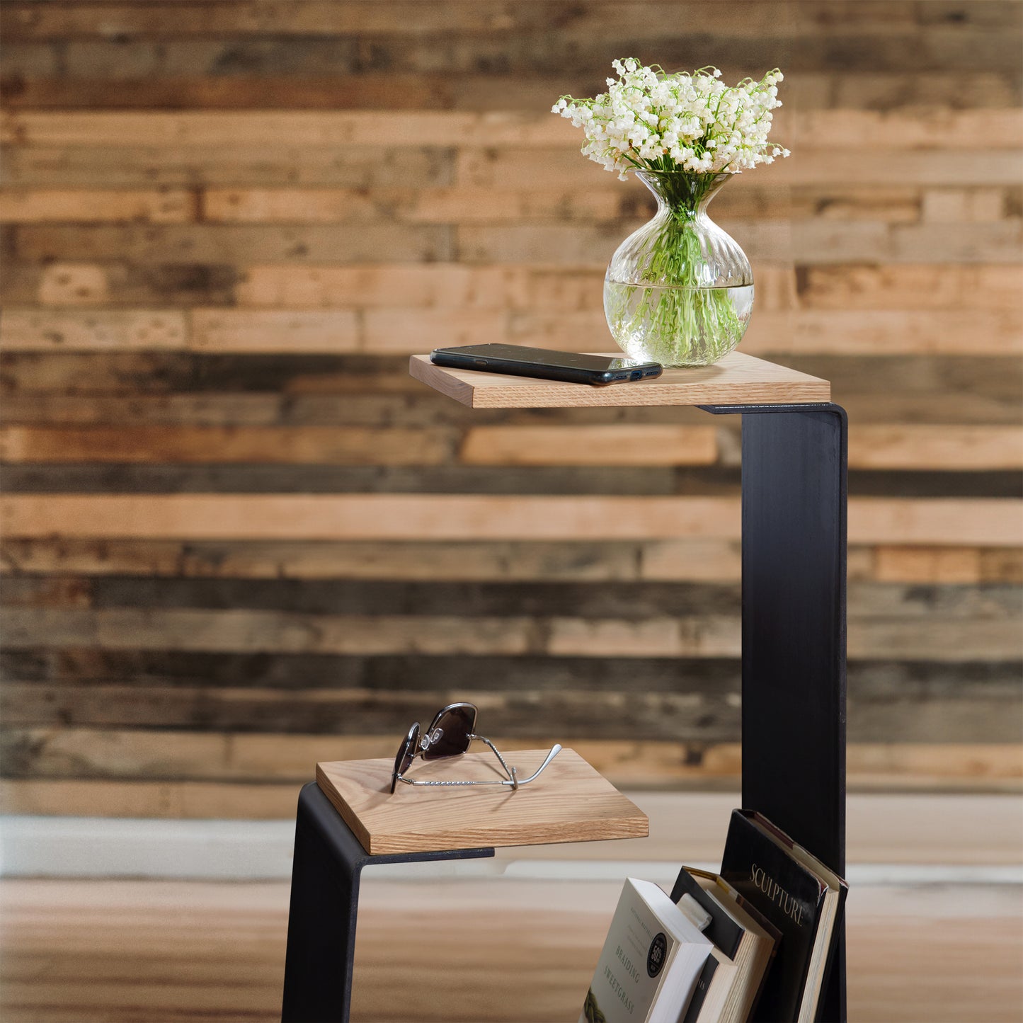 The G Table by Vermont Woods Studios, a modern geometric wooden shelf with multiple tiers, designed to display small items and books.